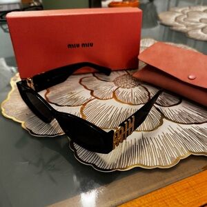 Miu Miu Black Sunglasses with Gold Detailing